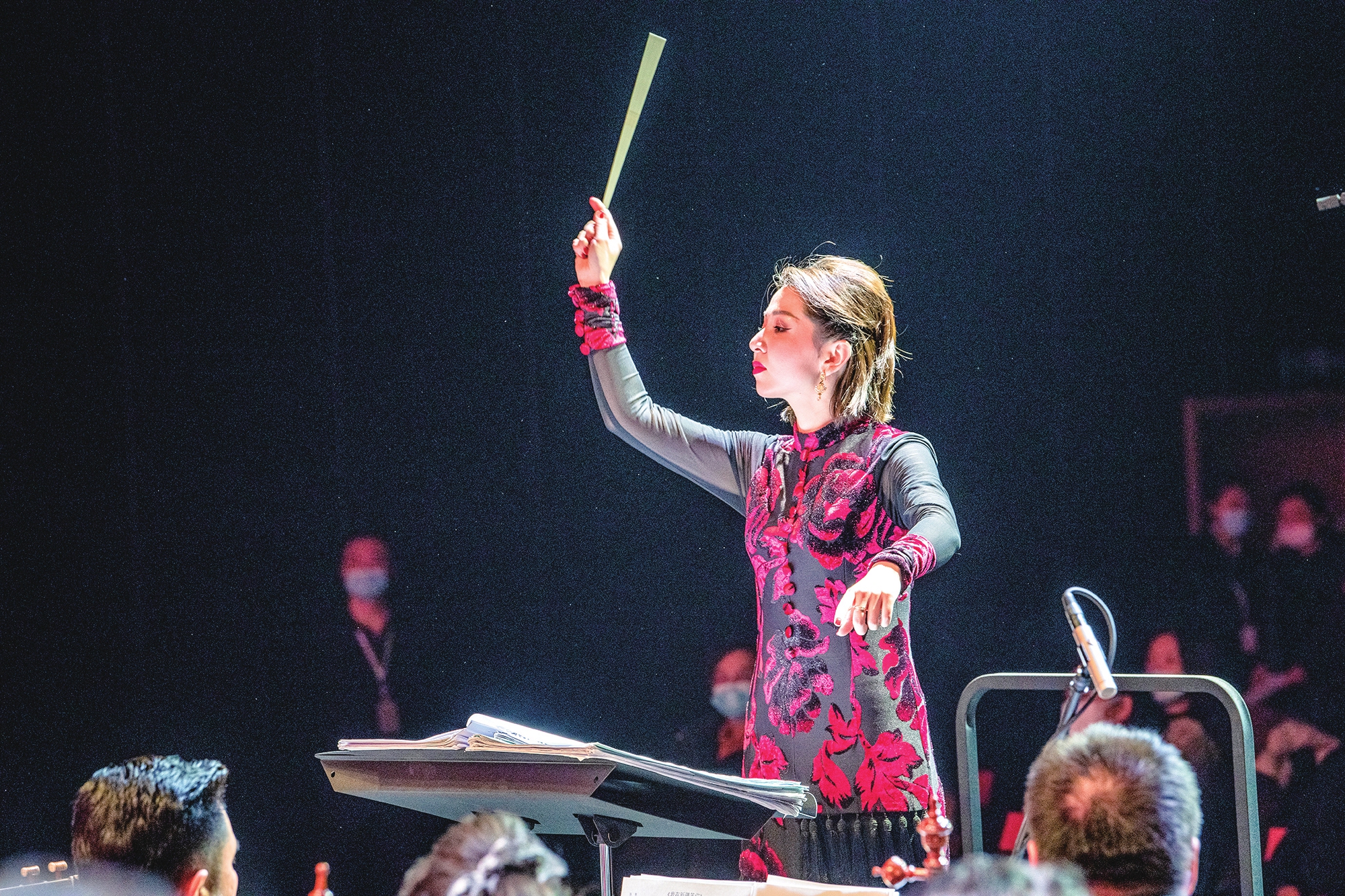 Nuerbana Yiming conducts during a concert with Xinjiang Arts Theater's folk orchestra. Photo: Courtesy of Muerbana Yiming