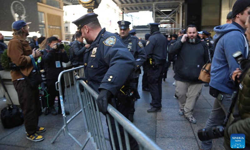 Policemen erect barricades in front of Trump Tower in New York, the United States, on March 21, 2023. Law enforcement in New York City stepped up security measures in sensitive areas after former U.S. President Donald Trump recently suggested that he would be arrested on Tuesday and called for his supporters to stage protests.(Photo: Xinhua)