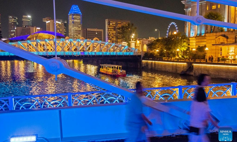 This photo shows bridges lit up in blue color to mark the World Water Day in Singapore on March 22, 2023.(Photo: Xinhua)