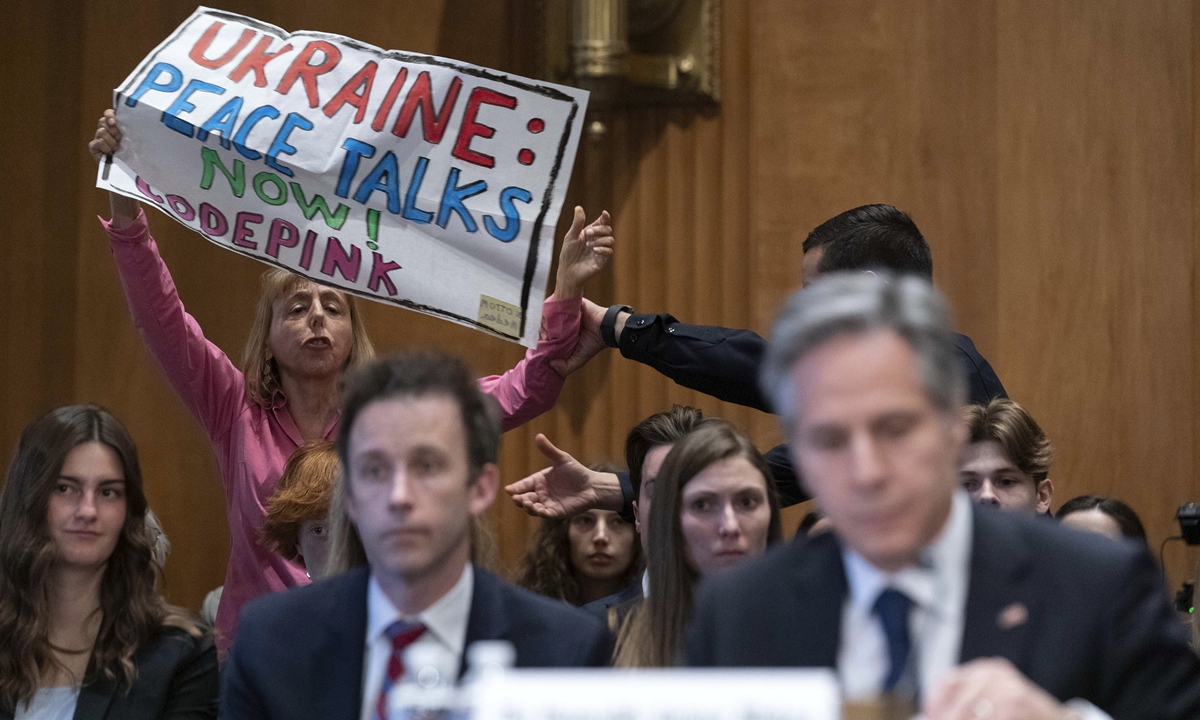A protester interrupts as US Secretary of State Antony Blinken testifies before Senate Foreign Relations Committee hearing on the budget request for the State Department for fiscal year 2024, on March 22, 2023. Photo: VCG