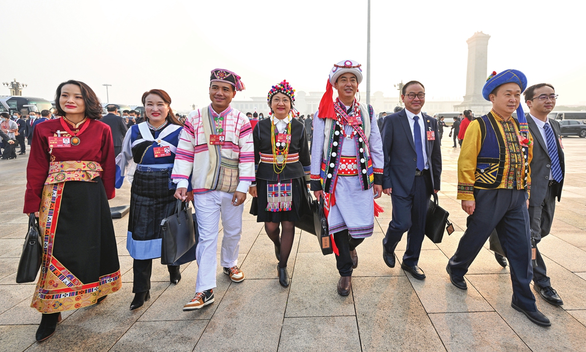 Deputies to the 14th National People's Congress (NPC) walk towards the Great Hall of the People for the opening meeting of the first session of the 14th NPC in Beijing on March 5, 2023. Photo: Xinhua