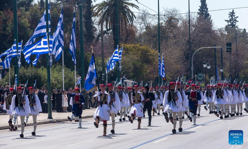 Members of Greece's Presidential Guard march during a military parade commemorating the Greek Independence Day in Athens, Greece, March 25, 2023. (Xinhua/Marios Lolos)