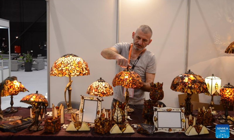 This photo taken on March 24, 2023 shows amber lamps at amber expo AMBERIF in Gdansk, Poland. The AMBERIF Spring 2023 was held on March 22-25 in Gdansk. (Xinhua/Chen Chen)