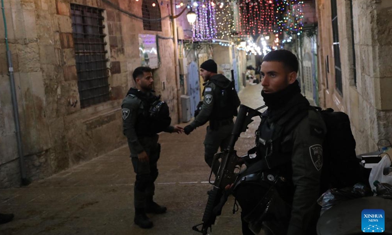 Israeli police stand guard after a reported shooting incident at the Al-Aqsa Mosque compound in Jerusalem, April 1, 2023. Earlier on Saturday, a Palestinian man was shot dead by Israeli police forces at the entrance to the Al-Aqsa mosque compound in Jerusalem. The police said the man attempted to carry out an attack against the forces, which was rejected by some Palestinians at the scene. (Photo by Muammar Awad/Xinhua)
