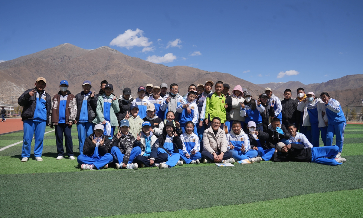 Gasong and her classmates have a photo taken after a physical education class on March 24, 2023 in No.1 Middle School of Lhasa. Photo: Li Jieyi/GT