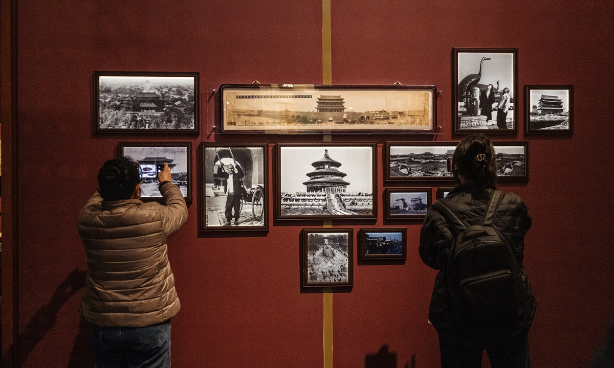 Visitors take photos at the Beijing Central Axis Exhibition at the Capital Museum in Beijing. Photo: Li Hao/GT