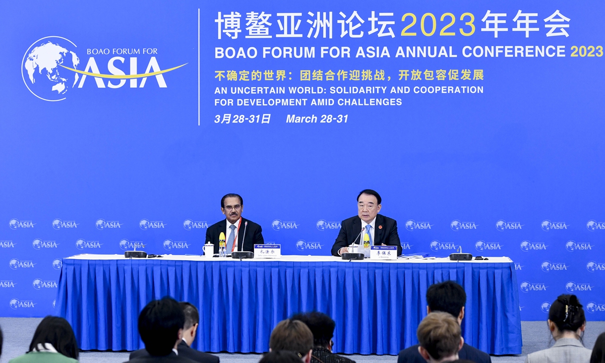 Li Baodong (right), secretary-general of the Boao Forum for Asia (BFA), releases two annual reports at a press conference during the BFA's annual conference on March 28, 2023 in Boao, South China's Hainan Province. The conference, under the theme 