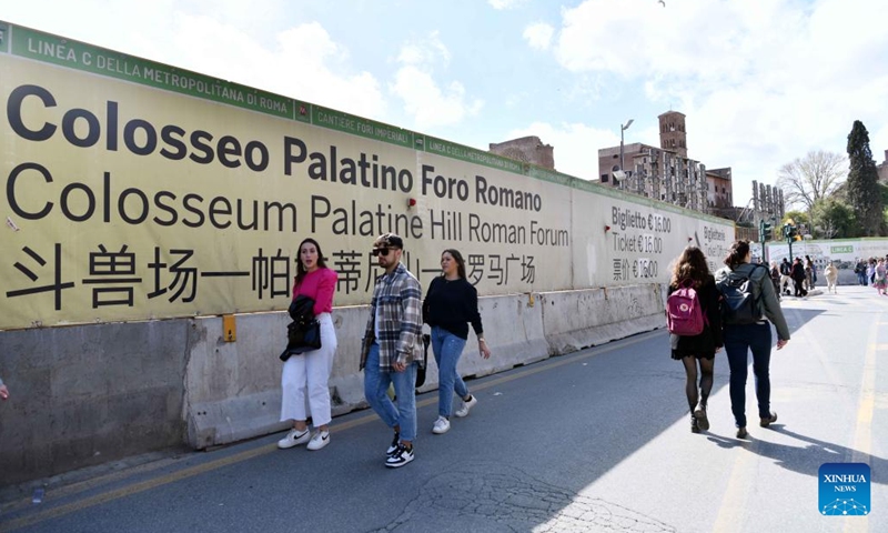 People walk past tourist information in various languages including Chinese near the Colosseum in Rome, Italy, on March 26, 2023.



Italy has been included on a second list of 40 destinations under a pilot program rolled out by China to resume outbound group travel. As the number of passenger flights between the two countries rebounds, more Chinese tourists are expected. Many public facilities and scenic areas in Italy now offer Chinese language services. (Xinhua/Jin Mamengni)