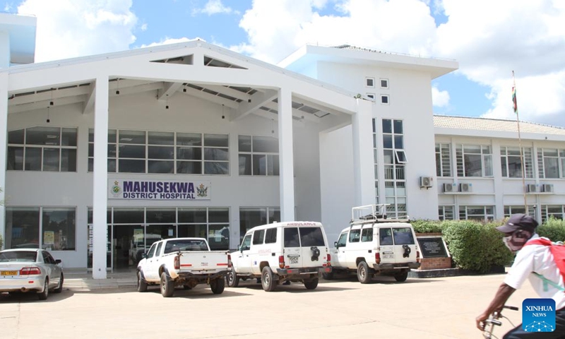 A cyclist rides into the Mahusekwa Hospital in Mahusekwa, Mashonaland East Province, Zimbabwe, on March 24, 2023. (Photo:Xinhua)