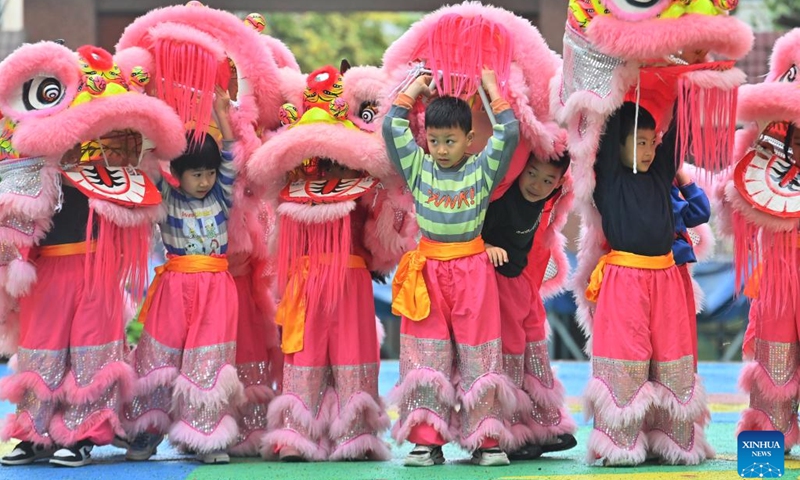 Children practice lion dance at a kindergarten in Tengxian County of Wuzhou, south China's Guangxi Zhuang Autonomous Region, March 28, 2023. The Tengxian Lion Dance, which is listed as a national intangible cultural heritage, is a combination of martial arts, dancing, music and acrobatics. In recent years, Tengxian County has been actively integrating the lion dance with courses in kindergartens and schools, with the goal of passing on this traditional art form to younger generations.(Photo: Xinhua)