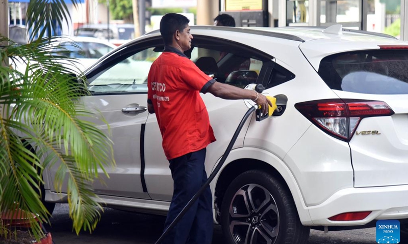 A man fuels a car at a gas station in Colombo, Sri Lanka, March 29, 2023. Sri Lanka's Power and Energy Minister Kanchana Wijesekera said on Wednesday that fuel prices will be reduced in the country from March 29 at midnight.(Photo: Xinhua)