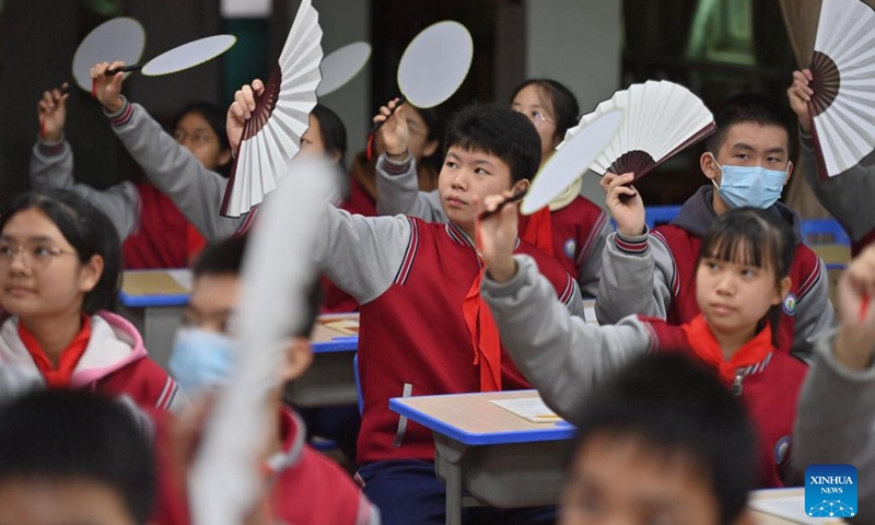 Students learn Cantonese opera at a middle school in Wuzhou City, south China's Guangxi Zhuang Autonomous Region, March 29, 2023. In recent years, Wuzhou City has introduced lion dance, Cantonese opera and tea art into the campus to enrich students' extracurricular life.(Photo: Xinhua)