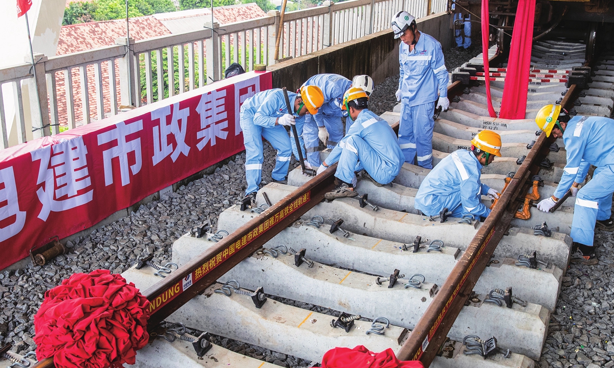 

Workers lay the last track of the Jakarta-Bandung High-Speed Railway line at Halim Station in Jakarta, Indonesia on March 31, 2023. The completion of the track on Friday laid a solid foundation for the opening of its operation with high quality. Photo: Xinhua
