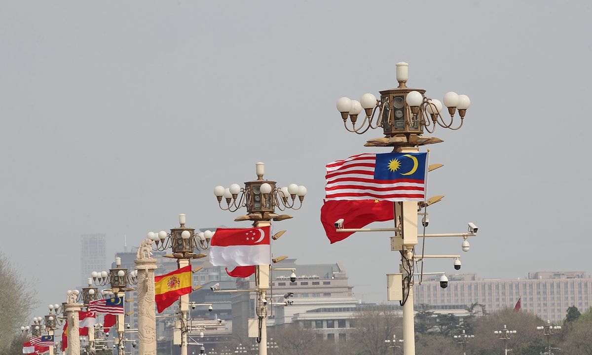 Flags of Singapore, Malaysia and Spain are raised in Tiananmen aquare on March 31, 2023, as Chinese President Xi Jinping meets with visiting Singapore's Prime Minister Lee Hsien Loong, Spanish Prime Minister Pedro Sanchez and Malaysia's Prime Minister Datuk Seri Anwar Ibrahim. Photo: VCG 