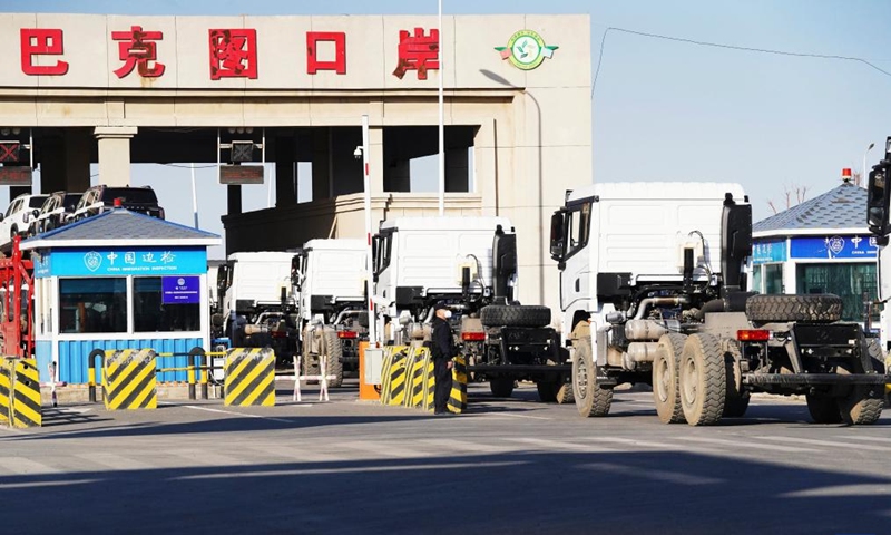 Outbound vehicles are seen at the Bakti port in Tacheng, northwest China's Xinjiang Uygur Autonomous Region, March 29, 2023. Located on the border of China and Kazakhstan, the exit and entry frontier inspection station of Bakti port has optimized clearance measures to improve the transportation efficiency since this year.(Photo: Xinhua)