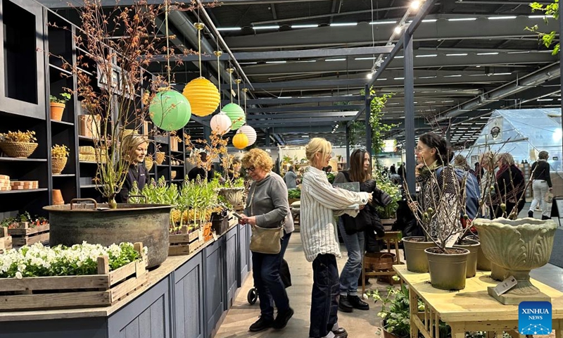 People visit the Nordic Gardens in Stockholm, Sweden, March 30, 2023. The Nordic Gardens, the leading garden fair in Scandinavia, kicked off on March 30 and will last until April 2.(Photo: Xinhua)