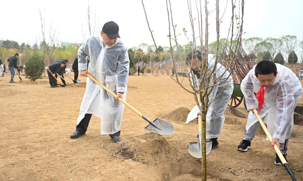 Chinese President Xi Jinping, also general secretary of the Communist Party of China Central Committee and chairman of the Central Military Commission, plants a tree during a voluntary tree planting activity in Beijing, capital of China, April 4, 2023. Xi and other leaders, including Li Qiang, Zhao Leji, Wang Huning, Cai Qi, Ding Xuexiang, Li Xi, and Han Zheng, planted trees with local people at a city park in the eastern district of Chaoyang in the spring shower. (Xinhua)