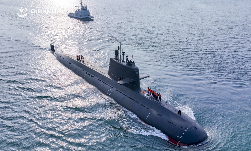 A submarine attached to a naval submarine flotilla under the PLA Northern Theater Command bears off a port after separating from the towboats during a training exercise on March 21, 2023. (eng.chinamil.com.cn/Photo by Wu Haodong)