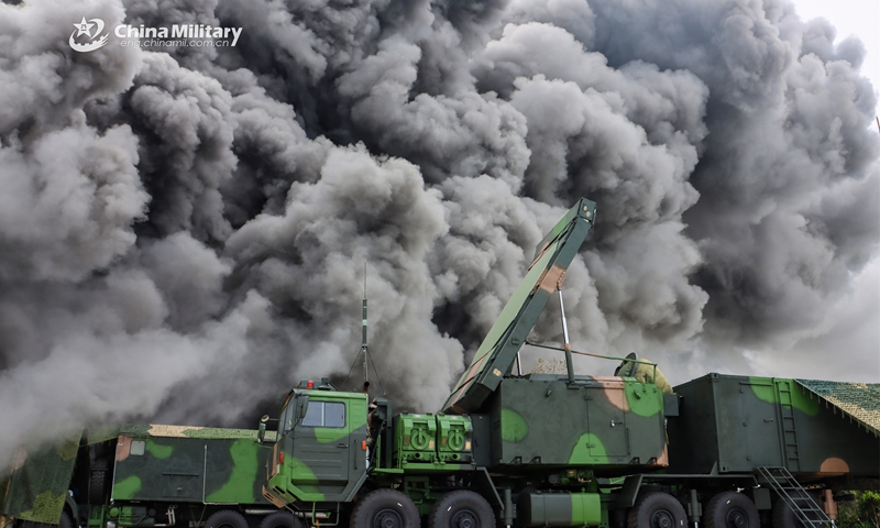 Vehicle-mounted radar systems attached to a surface-to-air missile brigade with the air force under the PLA Southern Theater Command use smoke to cover movement during a joint training exercise held by the brigade and a chemical defense unit in late March, 2023. (eng.chinamil.com.cn/Photo by Wang Junfa)