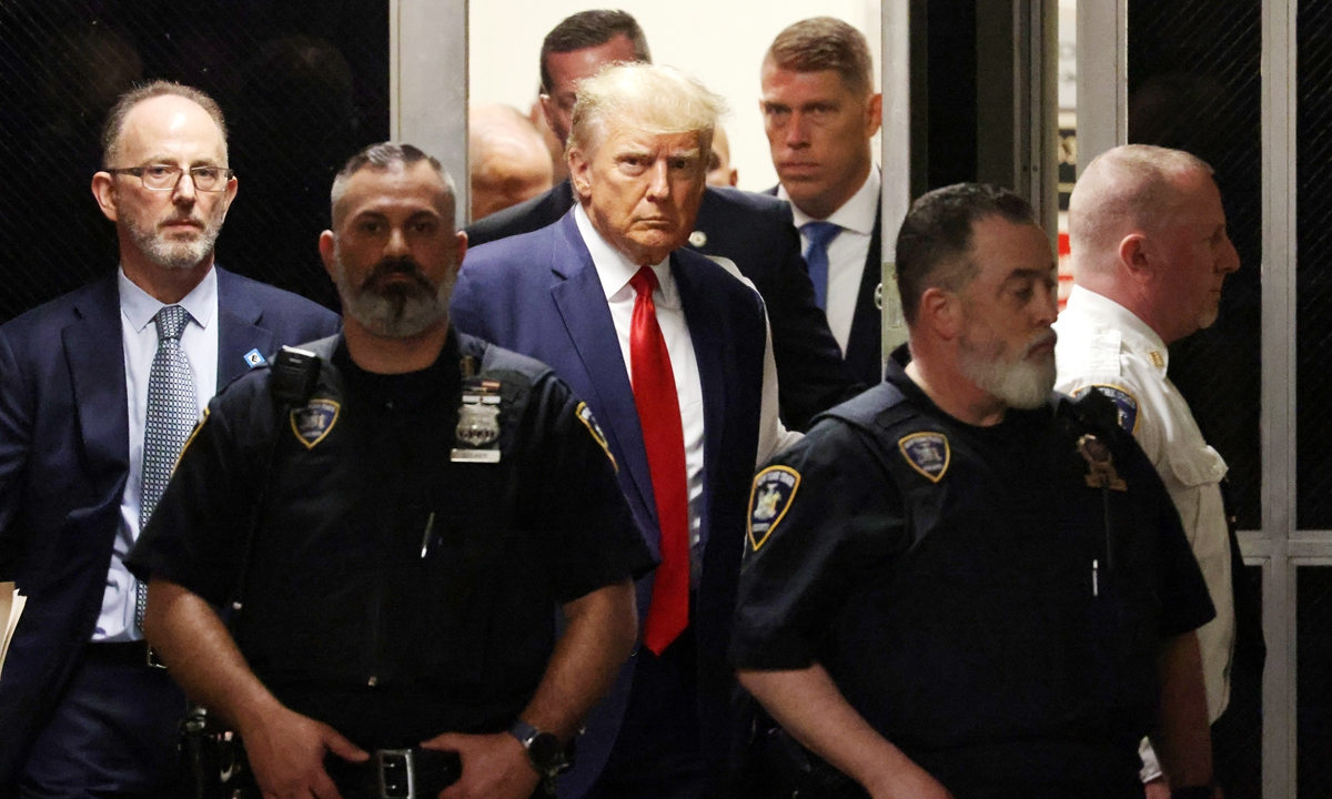 Former US president Donald Trump makes his <strong>888slot login</strong>way inside the Manhattan Criminal Courthouse in New York on April 4, 2023. Trump made an unprecedented appearance before a New York judge on the day to answer criminal charges that threaten to throw the 2024 White House race into turmoil. Trump pleaded not guilty in the criminal court to 34 felony charges.Photo:IC