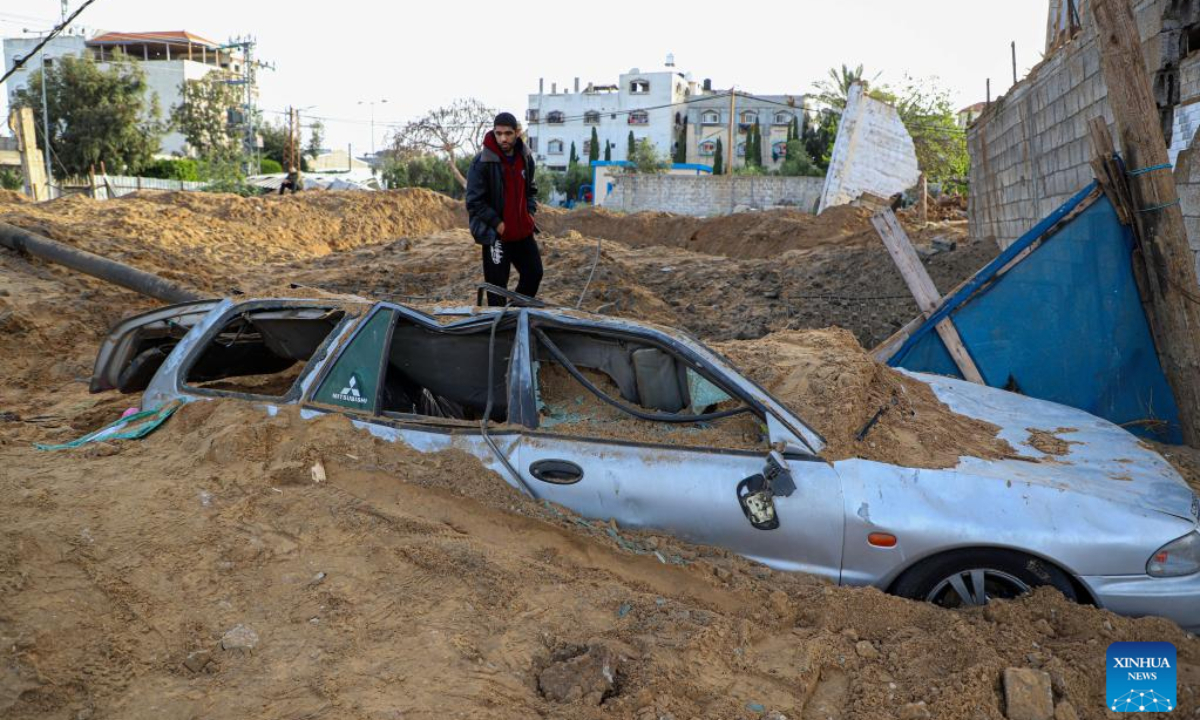 A man checks damages caused by an Israeli airstrike in Gaza City April 7, 2023. Israel on Friday intensified airstrikes on military posts in the Gaza Strip and Lebanon, in response to rockets fired from the areas at several parts in Israel, escalating tensions with Palestine over the past three days after Israeli police forcibly expelled Palestinian worshippers from the Al-Aqsa Mosque in East Jerusalem. Photo:Xinhua