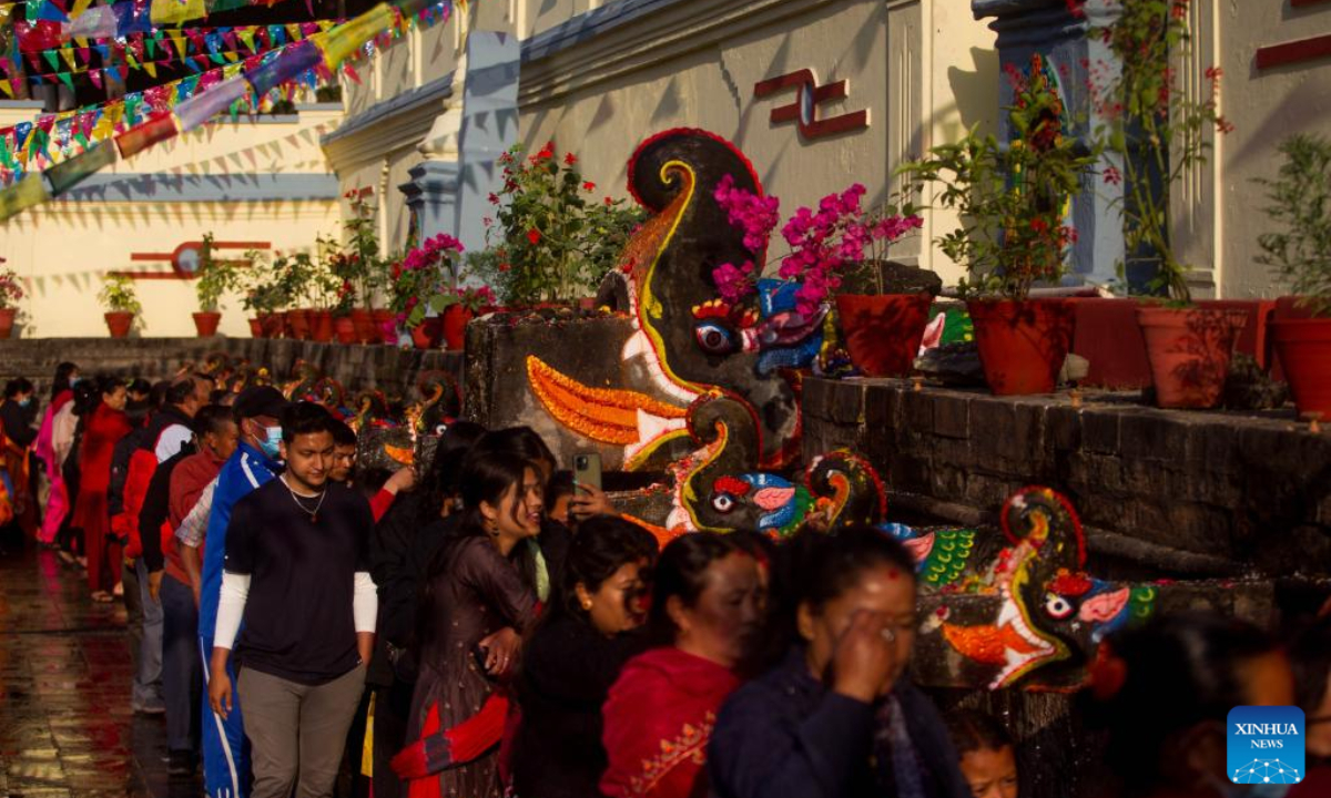 People perform a ritual during the Baishak Asnan festival in Kathmandu, Nepal, April 6, 2023. The locals believe that taking a holy bath on this day purifies one's spirit and makes one free from skin diseases. Photo:Xinhua
