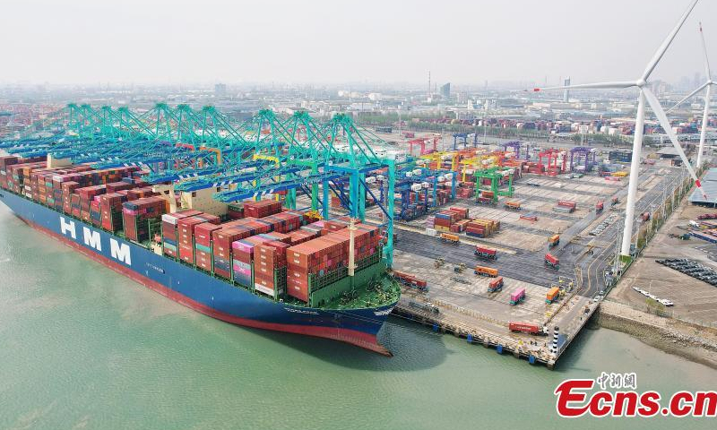 Drone photo shows a container ship loads containers at Tianjin Port, April 6, 2023. (Photo: China News Service/Tong Yu)