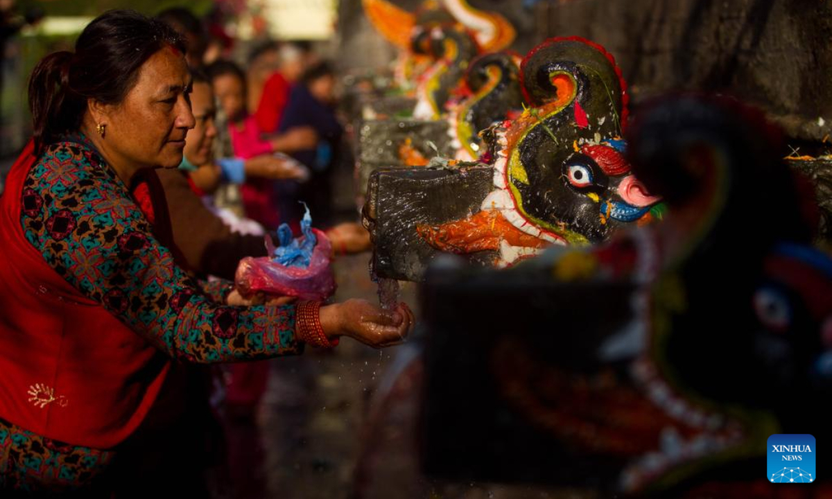 People perform a ritual during the Baishak Asnan festival in Kathmandu, Nepal, April 6, 2023. The locals believe that taking a holy bath on this day purifies one's spirit and makes one free from skin diseases. Photo:Xinhua