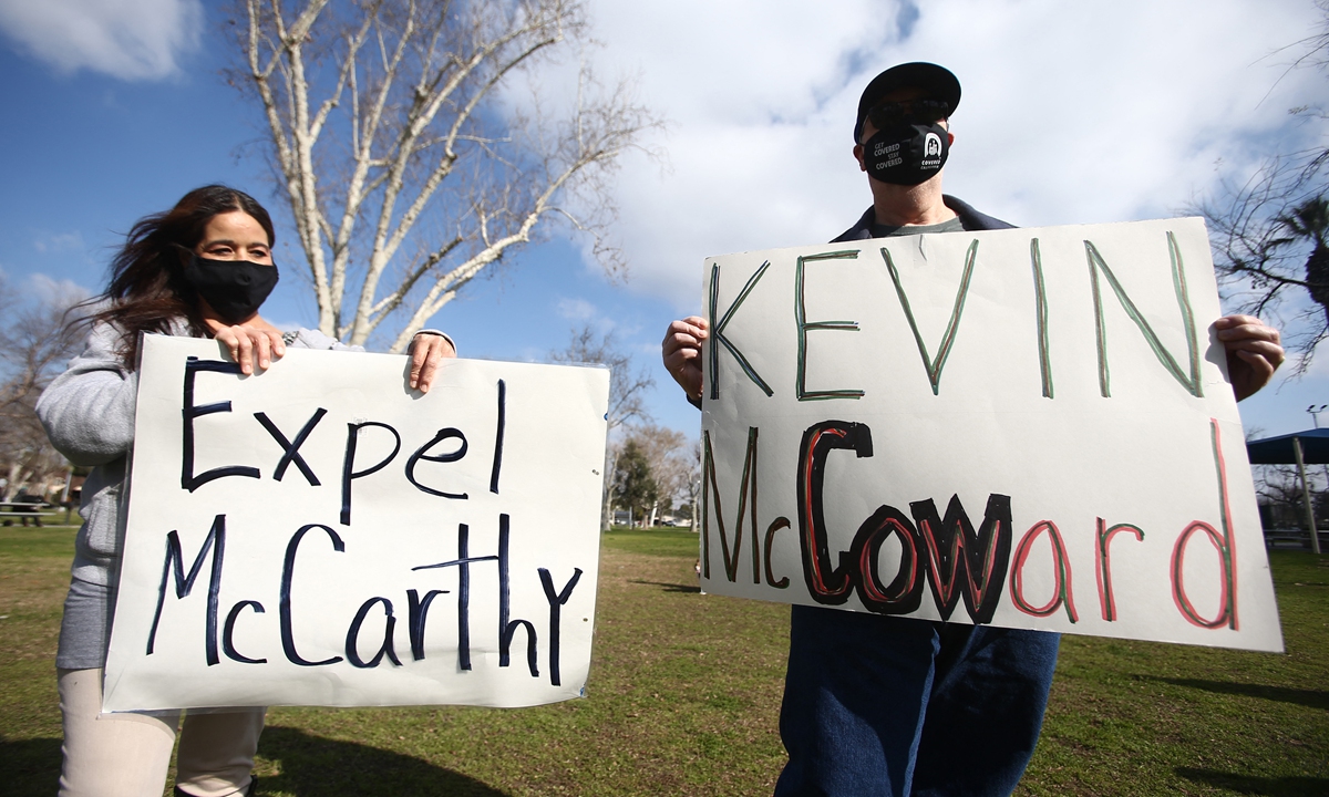 Demonstrators protest against Kevin McCarthy's push of his political ally Marjorie Taylor Greene, a far-right, controversial politician, to the House Committee on Education and Labor at McCarthy's Bakersfield office on February 04, 2021, in California, the US. Photo: AFP