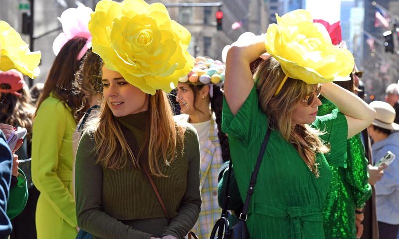 People take part in the Easter Bonnet Parade in New York, the United States, on April 9, 2023. The annual Easter Bonnet Parade took place on the Fifth Avenue of Manhattan near St. Patrick's Cathedral on Sunday.(Photo: Xinhua)