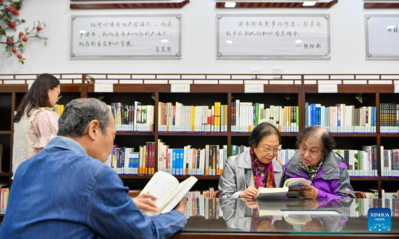 People read books at a bookstore in Hexi District, north China's Tianjin, April 21, 2023. Hexi District in north China's Tianjin Municipality has offered convenient reading service to its readers by developing a reading service system. With the system, libraries in the district can share their resources and readers can borrow and return books by one stop. (Xinhua/Sun Fanyue)