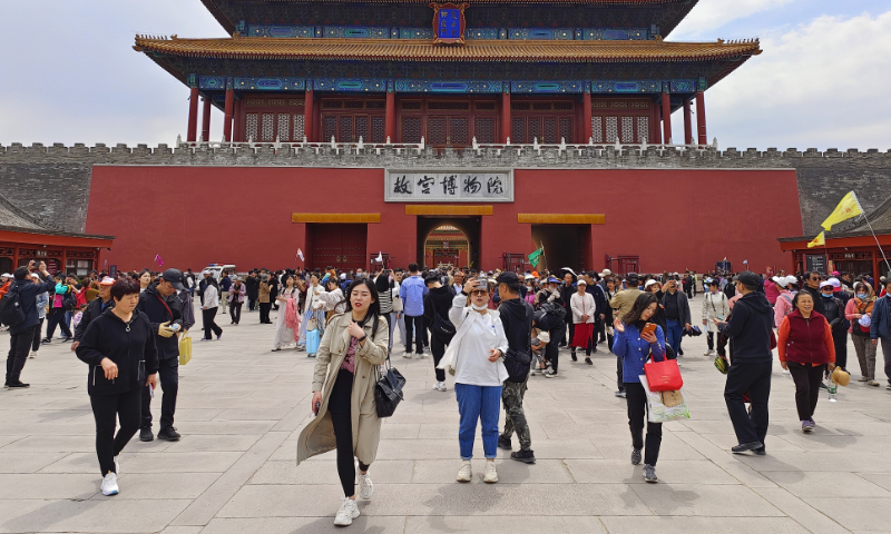 The photo taken on April 26, 2023 shows visitors to the Forbidden City in Beijing. Photo: VCG