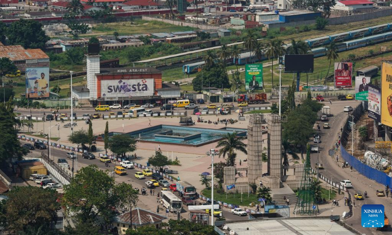 This photo taken on May 11, 2023 shows Kinshasa Central Railway Station (back) and Independence Square (C, front) in Kinshasa, the Democratic Republic of the Congo (DRC). Kinshasa is the capital, the largest river port and the largest city of the Democratic Republic of Congo and is also the political, economic and cultural center of the country. (Xinhua/Han Xu)