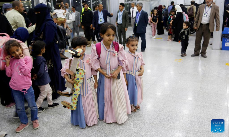 Yemeni children stand at the arrival hall of the Sanaa International Airport after being evacuated from Sudan, in Sanaa, Yemen, on May 14, 2023. (Photo by Mohammed Mohammed/Xinhua)