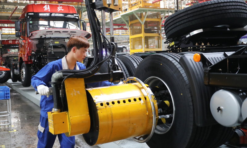 A worker assembles a truck at an auto company in Qingdao, East China's Shandong Province, on May 15, 2023. Qingdao's Jimo district has more than 400 vehicle and supporting production enterprises, covering the complete industry chain, which have injected new momentum into the development of local economy. Photo: VCG