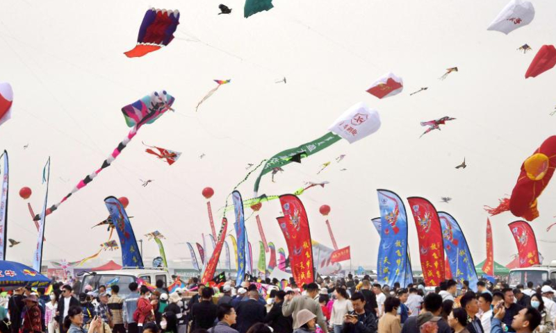 People attend the 40th Weifang International Kite Festival in Weifang, east China's Shandong Province, April 15, 2023.

The kite flying competition of the 40th Weifang International Kite Festival kicked off here Saturday. (Xinhua/Li Ziheng)