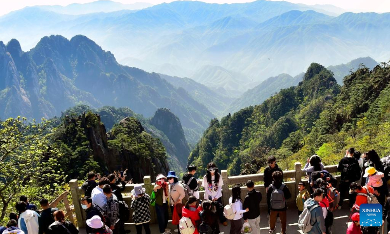 Tourists visit Huangshan Mountain in east China's Anhui Province on April 30, 2023. (Photo by Cai Ji'an/Xinhua)