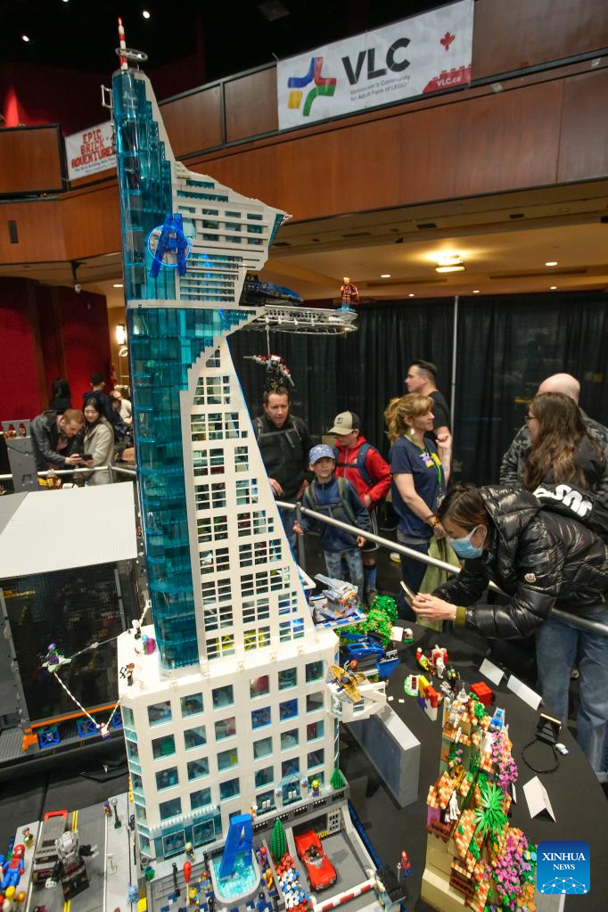 People look at the LEGO installations displayed at the BrickCan LEGO exhibition at the River Rock Theatre in Richmond, British Columbia, Canada, on April 22, 2023. Over 300 LEGO builders from around the world showcased their creations at BrickCan 2023, which was held here in Richmond between April 22 and 23. (Photo by Liang Sen/Xinhua)