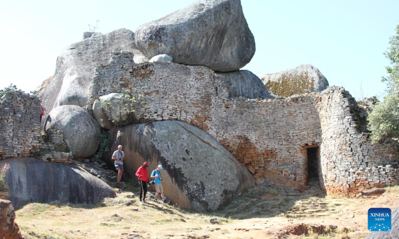 Tourists visit the Great Zimbabwe National Monument in Masvingo Province, Zimbabwe, May 5, 2023. The Great Zimbabwe National Monument was inscribed on the list of world cultural heritages by the UNESCO in 1986 and is one of Zimbabwe's greatest tourist attractions. (Xinhua/Zhang Baoping)