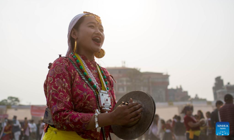 A woman from the Kirat community plays the cymbal during the celebration of the Ubhauli festival in Kathmandu, Nepal, May 13, 2023. (Photo by Sulav Shrestha/Xinhua)