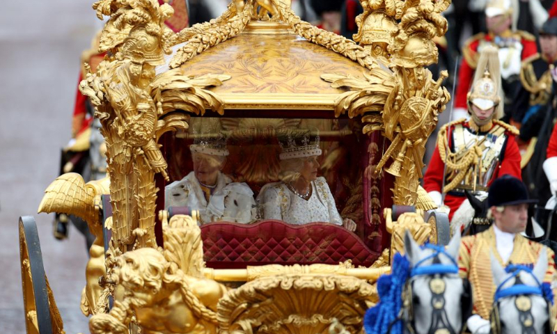 Britain's King Charles III and Queen Camilla return to Buckingham Palace after coronation service at Westminster Abbey in London, Britain, May 6, 2023. Charles III was on Saturday crowned monarch of the United Kingdom (UK) and 14 other Commonwealth realms in the UK's first coronation since 1953 at Westminster Abbey in central London. (Xinhua/Li Ying)