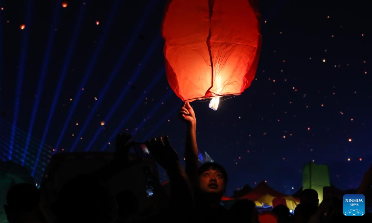 Sky lanterns released during annual Water Splashing Festival in SW