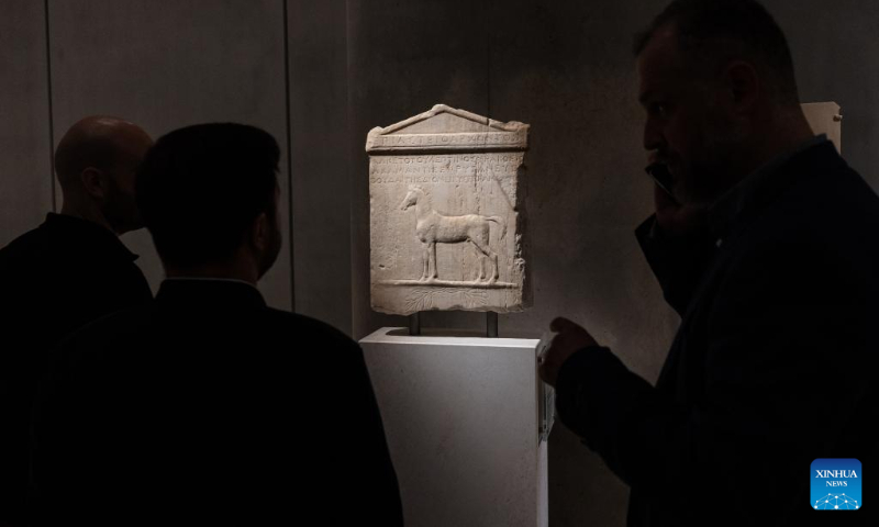 This photo taken on May 13, 2023 shows people watching the ancient masterpieces of museum collection at the Acropolis Museum in Athens, Greece. (Photo by Lefteris Partsalis/Xinhua)