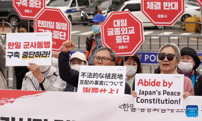 Protesters hold a rally against Japanese Prime Minister Fumio Kishida's visit to South Korea in Seoul, South Korea, May 7, 2023. Several South Korean organizations rallied here Sunday to protest Japanese Prime Minister Fumio Kishida's visit to South Korea. The protesters called for Tokyo's apology over its militarist past, opposed South Korea-Japan military cooperation, and demanded withdrawal of Japan's plan to discharge radioactive wastewater. (Photo by James Lee/Xinhua)