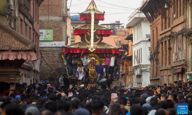 People pull the chariot of Lord Bhairav during the first day of the Bisket Jatra Festival at Bhaktapur Durbar Square in Bhaktapur, Nepal, April 10, 2023. The festival is celebrated annually to welcome the arrival of spring and the start of Nepali New Year.(Photo: Xinhua)