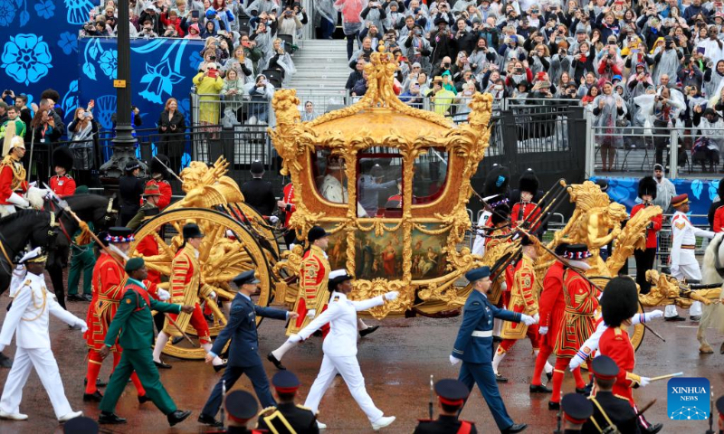 Britain's King Charles III and Queen Camilla return to Buckingham Palace after coronation service at Westminster Abbey in London, Britain, May 6, 2023. Charles III was on Saturday crowned monarch of the United Kingdom (UK) and 14 other Commonwealth realms in the UK's first coronation since 1953 at Westminster Abbey in central London. (Xinhua/Li Ying)