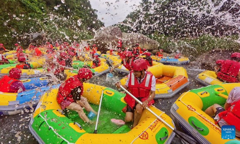 Tourists enjoy rafting in Wuzhishan City, south China's Hainan Province, April 30, 2023. China is witnessing a travel boom during this year's five-day May Day holiday. (Photo by Guo Zhihua/Xinhua)
