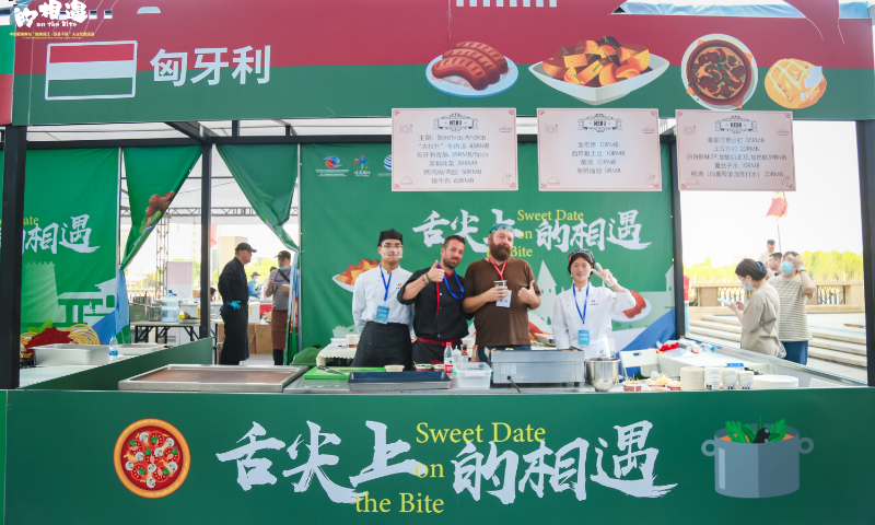 Staff showcase characteristic foods from Hungary at a special cultural exchange event - Sweet Date on the Bite - on the sideline of the third China-CEEC Expo & International Consumer Goods Fair, on May 15, 2023. Photo: Courtesy of the expo organizer