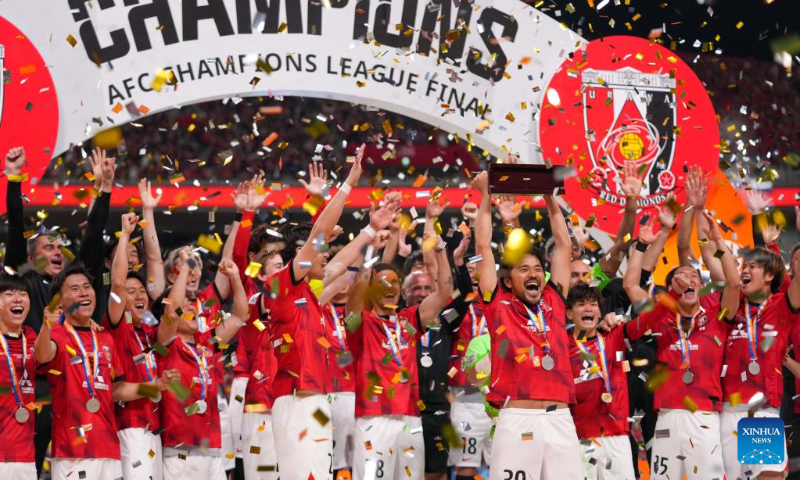 Members of Urawa Reds pose on the podium after the final 2nd leg of 2022 AFC Champions League against Al Hilal at Saitama Stadium 2002 in Saitama, Japan on May 6, 2023. (Xinhua/Zhang Xiaoyu)
