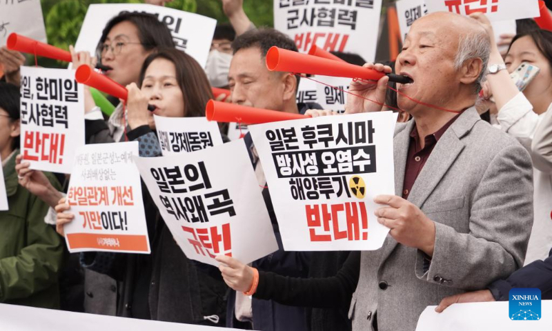 Protesters hold a rally against Japanese Prime Minister Fumio Kishida's visit to South Korea in Seoul, South Korea, May 7, 2023. Several South Korean organizations rallied here Sunday to protest Japanese Prime Minister Fumio Kishida's visit to South Korea. The protesters called for Tokyo's apology over its militarist past, opposed South Korea-Japan military cooperation, and demanded withdrawal of Japan's plan to discharge radioactive wastewater. (Photo by James Lee/Xinhua)